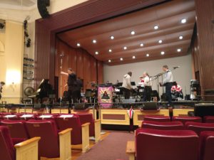 students on stage in auditorium