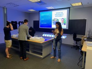 group in room with projector screen