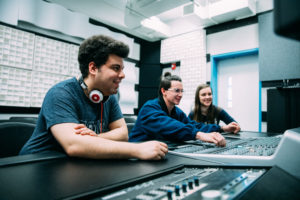 students working in recording studio